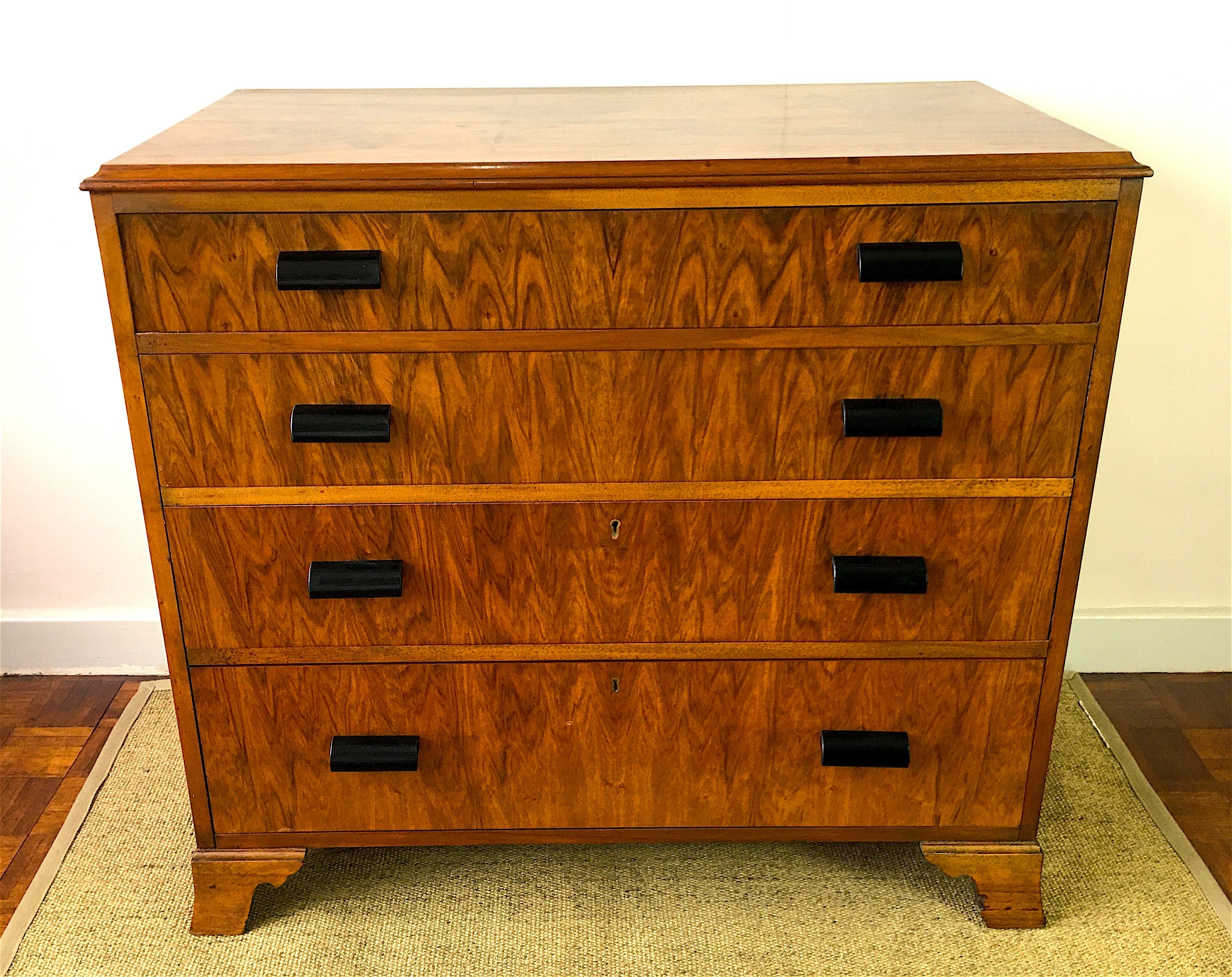 An Art Deco style figured walnut chest of four drawers, width 92cm, depth 50cm, height 83cm